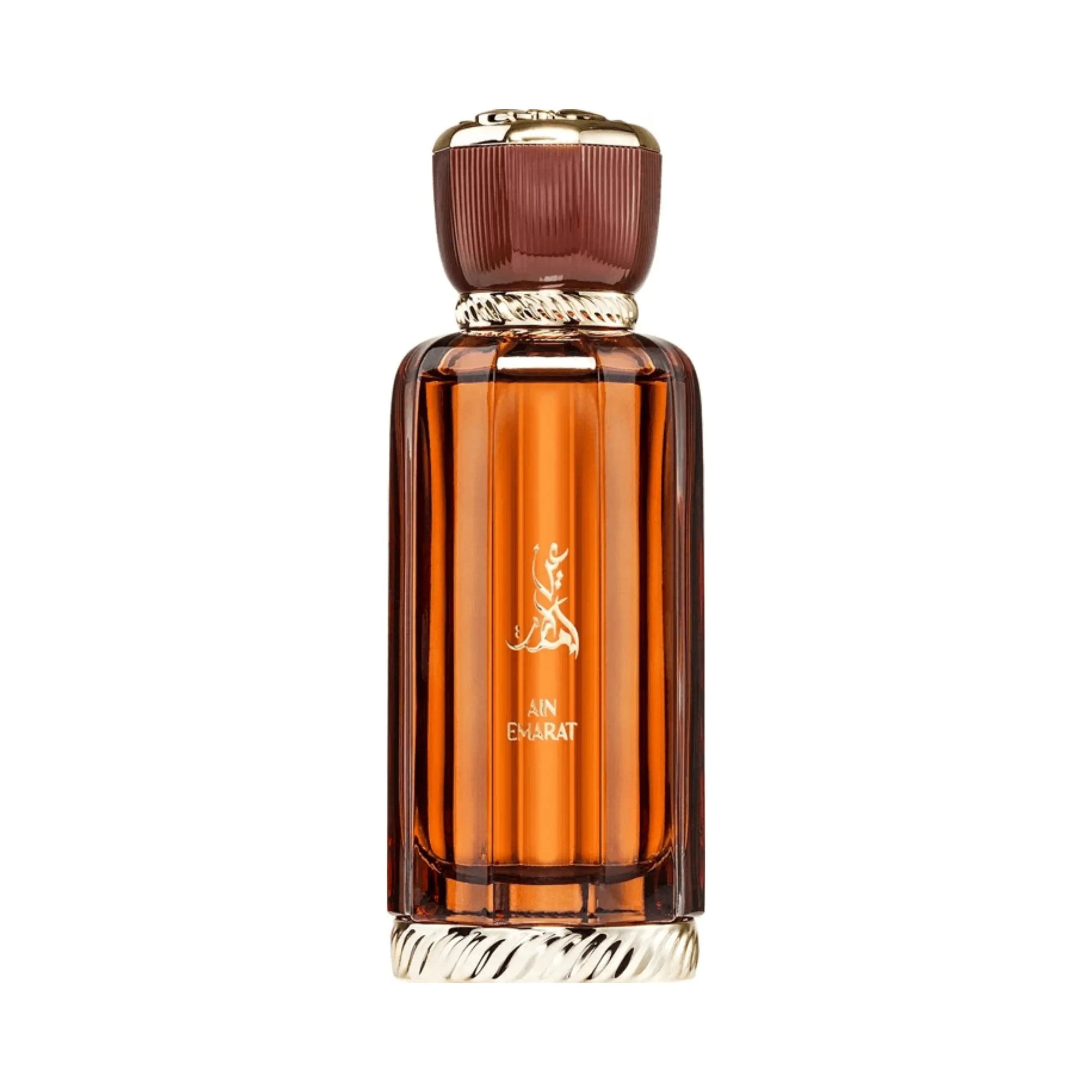 Al Wataniah Ain Emarat オードパルファム 100ml/3.4fl.oz. - 琥珀色のリブ加工ガラスボトル、ゴールドのキャップ、アラビア書き込み、白い背景 - ボトルのみ