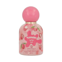 Perfume bottle with a pink spherical cap and a colorful label featuring lychees. The label reads "Tubbees Lychee Lush, Eau de Parfum," conveying a fruity and vibrant tone.