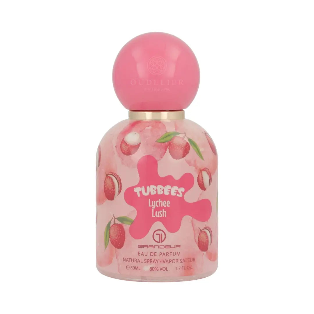 Perfume bottle with a pink spherical cap and a colorful label featuring lychees. The label reads "Tubbees Lychee Lush, Eau de Parfum," conveying a fruity and vibrant tone.